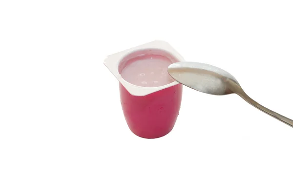 Fruktig yoghurt och sked isolerad på vita backg — Stockfoto
