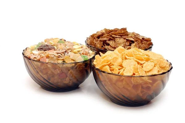 Drie kopjes met verschillende cornflakes — Stockfoto