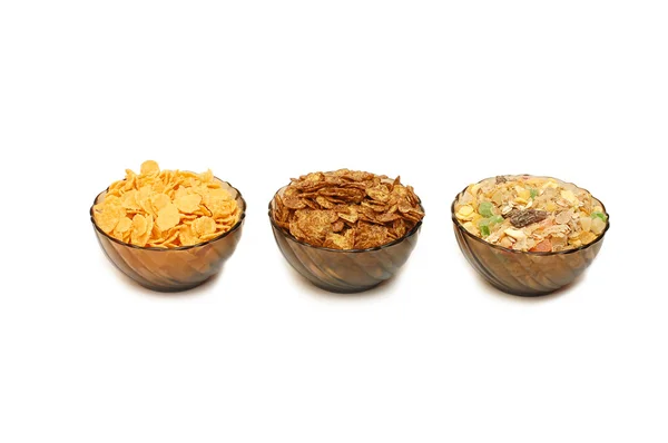 Tre tazze con diversi corn flakes — Foto Stock