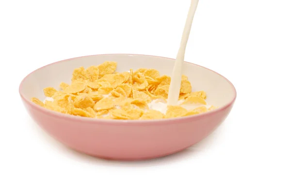 Corn flakes in bowl with milk — Stock Photo, Image