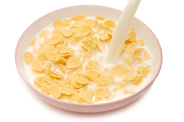 Płatki kukurydziane w misce z mlekiem — Zdjęcie stockowe