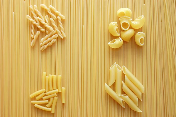 Four different kinds of italian pasta. Food back — Stock Photo, Image