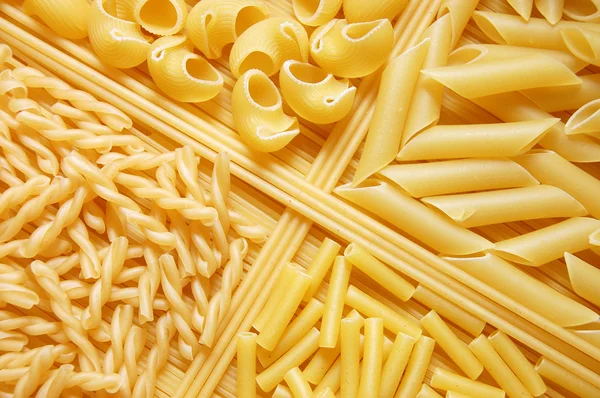 Fyra olika sorters italiensk pasta. mat tillbaka — Stockfoto
