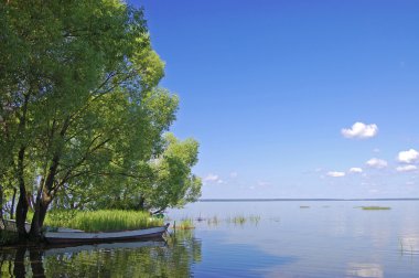 Fishing boat at lake in Pereslavl. Russia clipart