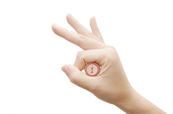 A mão feminina segura Keg número um em um branco — Fotografia de Stock