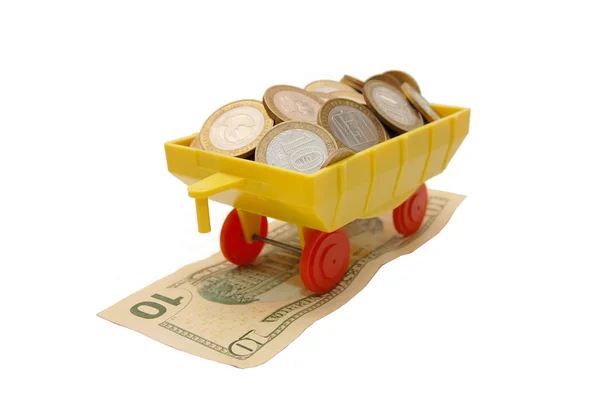 Comboio de brinquedo transportando moedas em um branco — Fotografia de Stock