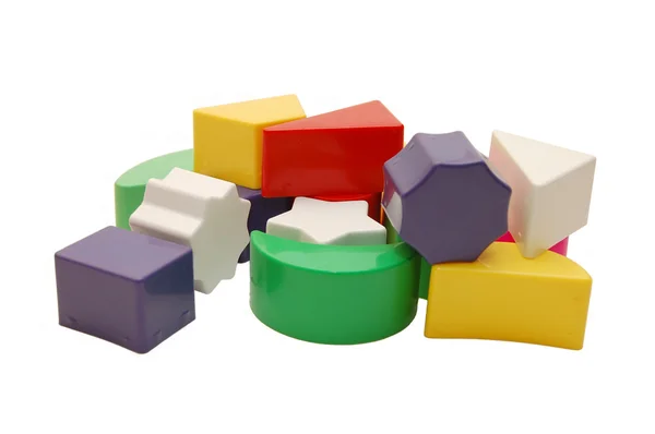 Figuras geométricas plásticas multicoloridas — Fotografia de Stock