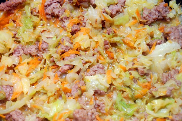 Stewed cabbage with meat and car — Stock Photo, Image