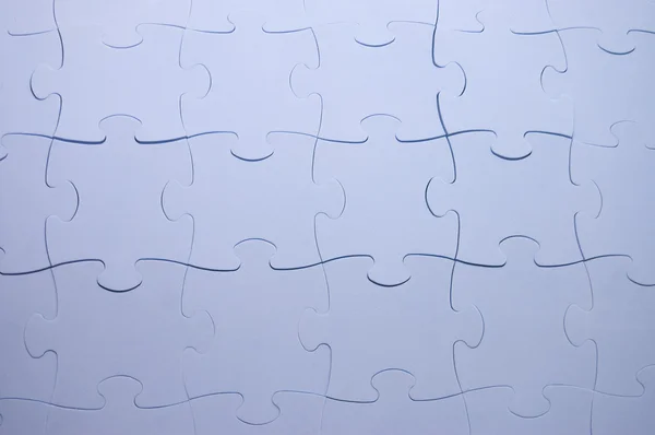 Die kombinierten Teile eines blauen Puzzles — Stockfoto