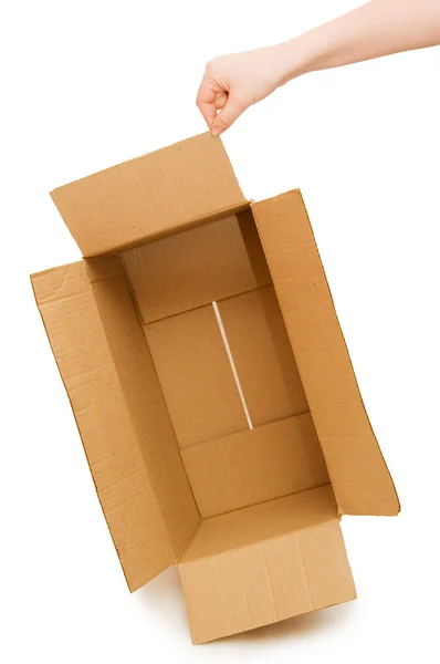 Mãos abertas uma caixa de papelão isolado — Fotografia de Stock