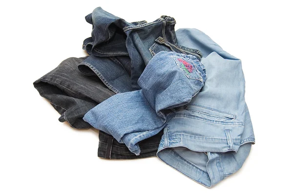 Набір джинсів ізольовано на білому — стокове фото