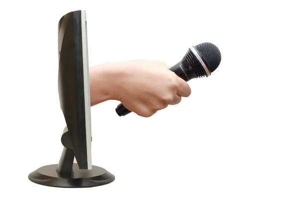 Hand mit Mikrofon vom Monitor — Stockfoto