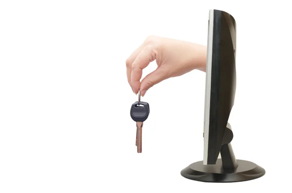 Ženská ruka s klíči od monitoru — Stock fotografie