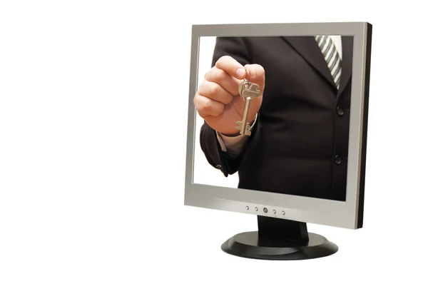 Podnikatel s klíči od monitoru — Stock fotografie