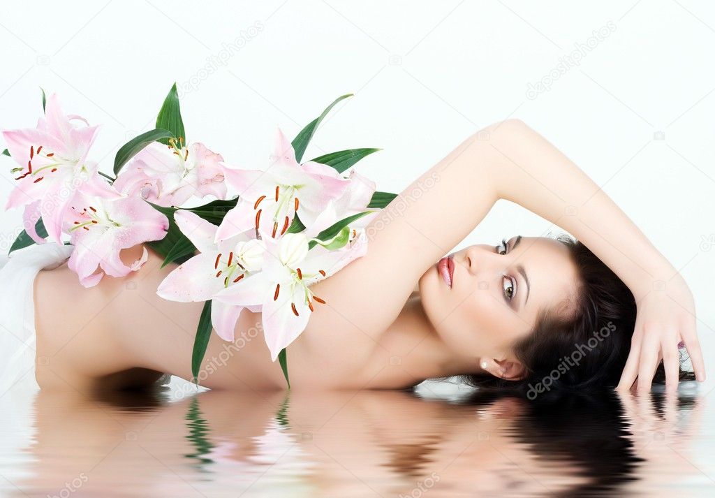 Beautiful Woman With The Pink Flowers.