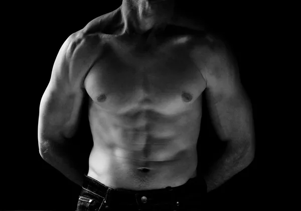 B & W sporty man on black background — стоковое фото