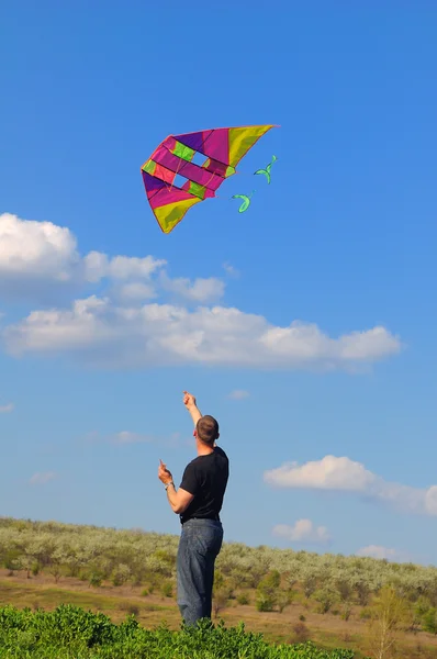 Young man flying a kite — Stock Photo, Image