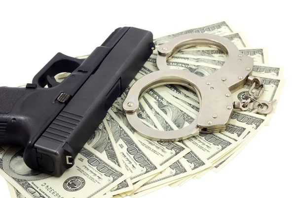 Black gun, bracelets and cash — Stock Photo, Image