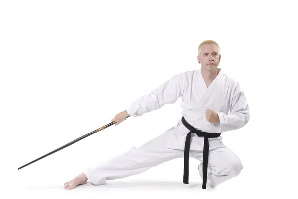 First Degree Black Belt with staff. — Stock Photo, Image