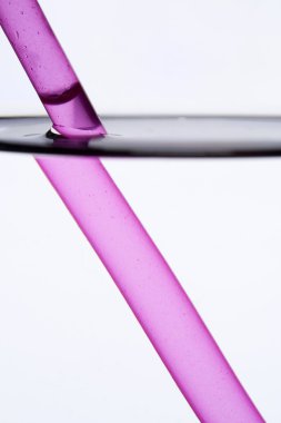 Drinking straw refracted by water clipart