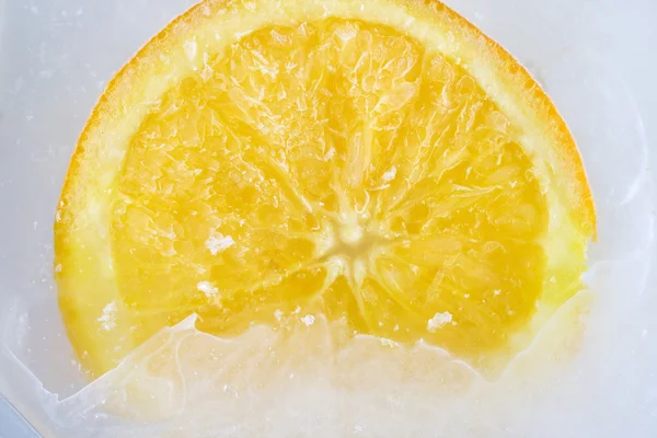 Orange on ice — Stock Photo, Image
