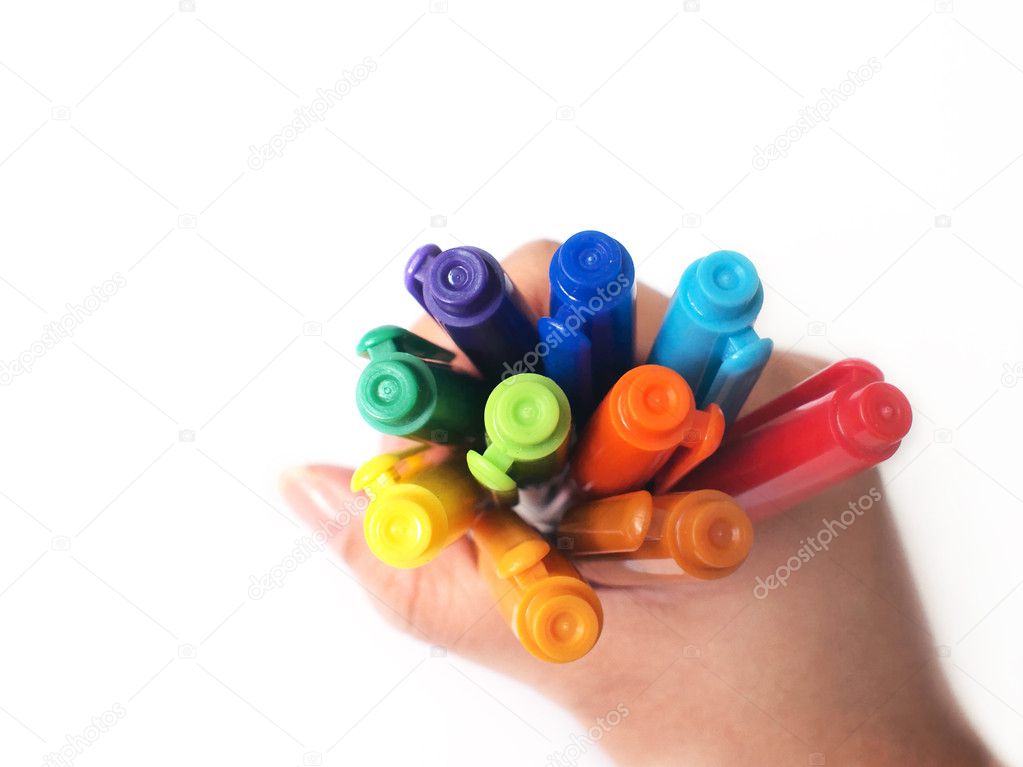 A hand holding colorful pens