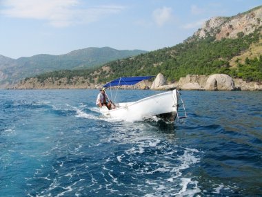 Man driving a boat clipart