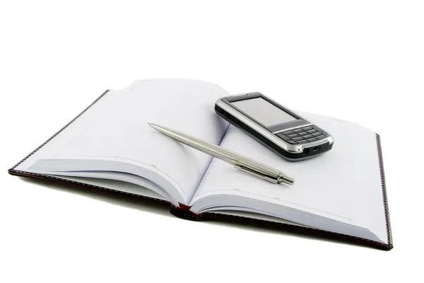 Jegyzetfüzet, toll és mozgatható telefon — Stock Fotó