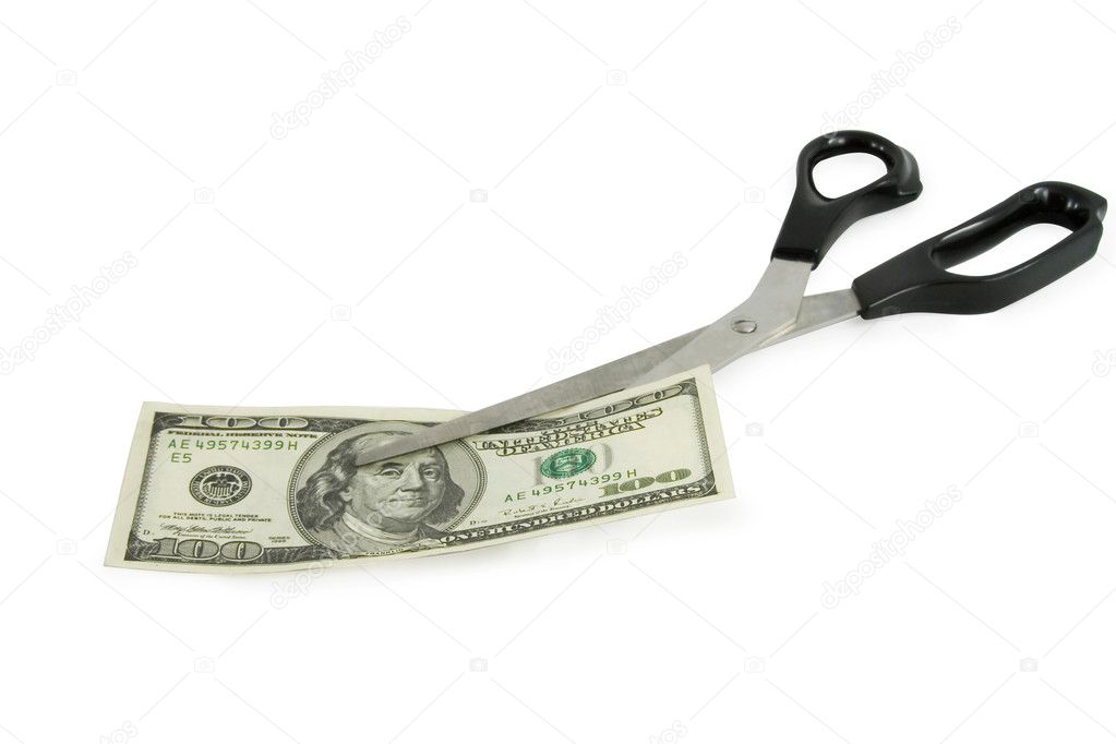 Scissors cutting a 100 dollars