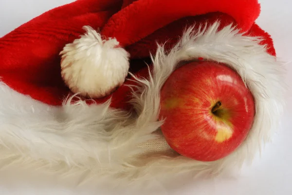 Apple in Santa Claus cap — Stock Photo, Image