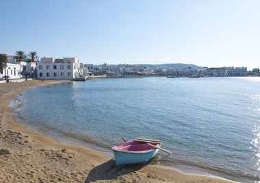 Lonely boat on lagoon in Mykonos clipart