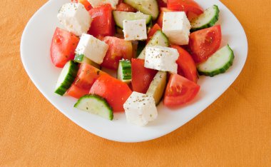 Greek salad with fresh vegetables clipart