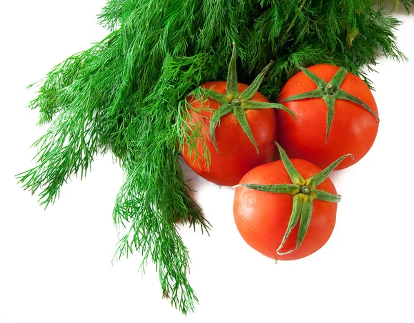 3 свежих помидора и пачка укропа Лицензионные Стоковые Фото