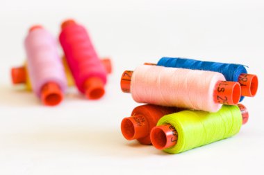 Multicolor yarn bobbins clipart