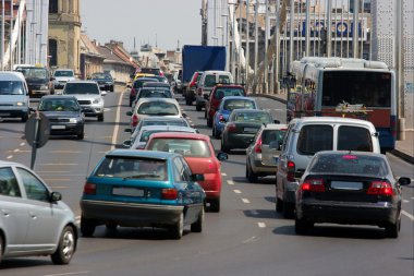 Heavy traffic passing through a bridge clipart