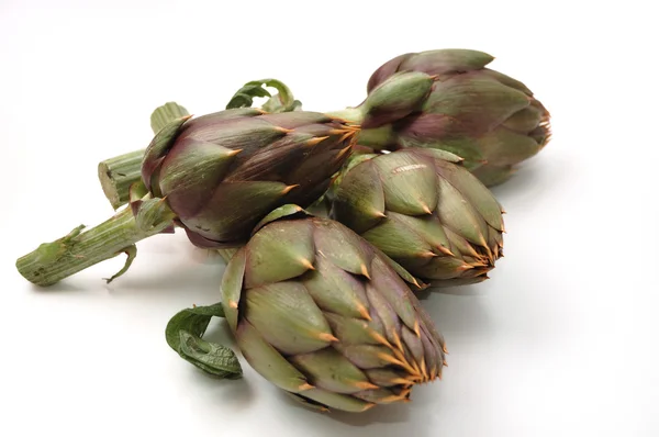 stock image Four artichokes closeup