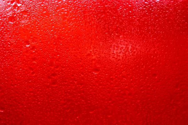 Vidrio rojo con gotas de agua —  Fotos de Stock