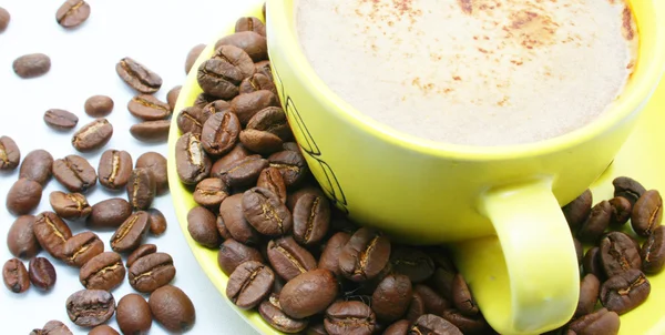Cacao beans and cup with coffee — Stock Photo, Image