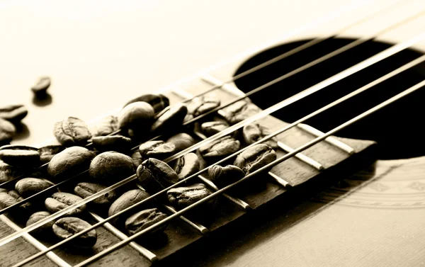 Cocoa beans on a classical guitar — Stock Photo, Image
