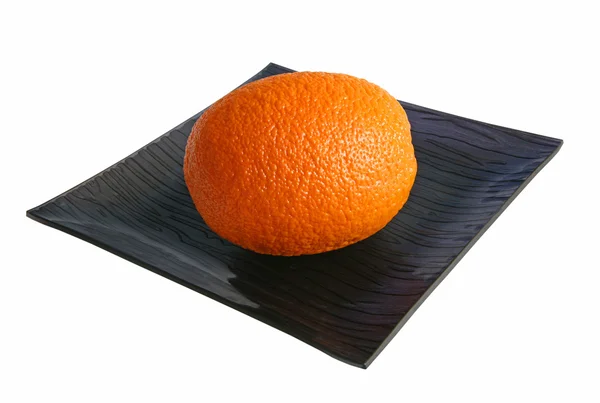 Апельсин на блюде — стоковое фото