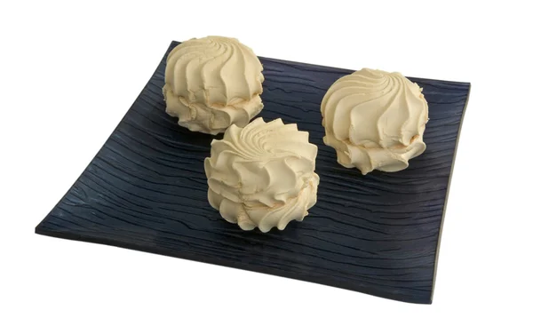 Cream marshmallows  on a black dish — Stock Photo, Image