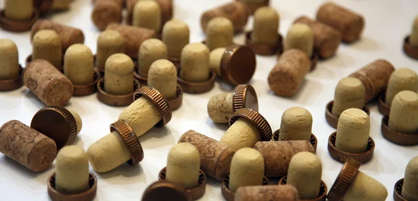 Cognac and wine corks on a table — Stock Photo, Image