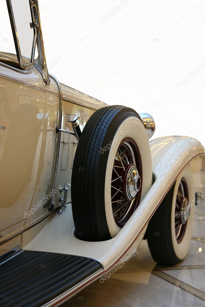 Side of beige cabriolet retro car