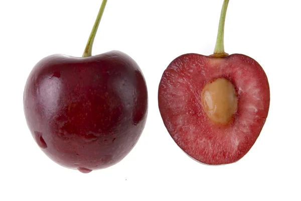 One full cherry and a half of it — Stock Photo, Image