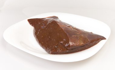 Beef liver on white plate clipart