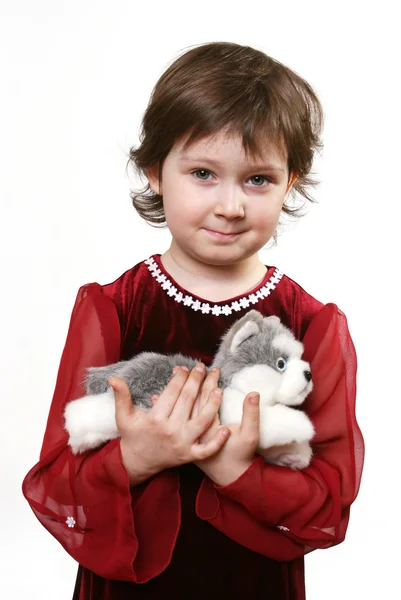 Little girl with toy puppy — Stock Photo, Image