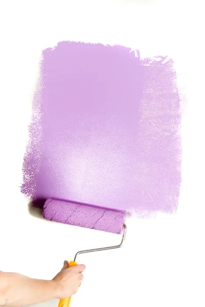 Paint roller in hand — Stock Photo, Image