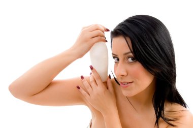 Portrait of young female holding lotion clipart