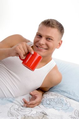 Smiling handsome man drinking coffee clipart