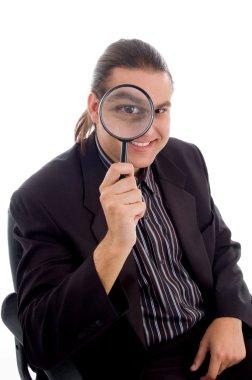 Young investigator holding magnifier clipart